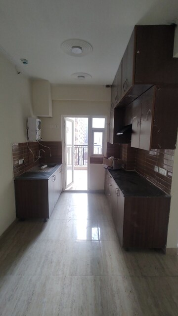 Kitchen in 3 BHK Apartment at Amrapali Centurian Park, Tech Zone 4 Greater Noida – for Sale