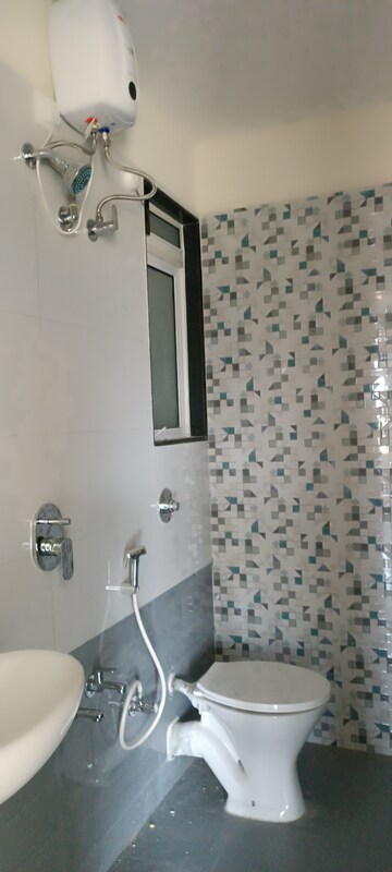 Bathroom in 1 BHK Apartment at Damji Shamji Kalpvruksha Tulip, Kasarvadavali – for Rent