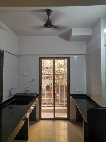 Kitchen in 2 BHK Apartment at Vijay Annex 11, Waghbil – for Sale