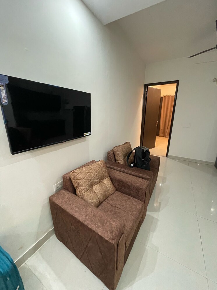 Living Room, emaar-mgf-the-palm-drive-studios 3 Bedroom 1950 Sq.Ft. Apartment In Sector 66 Gurgaon 8209934