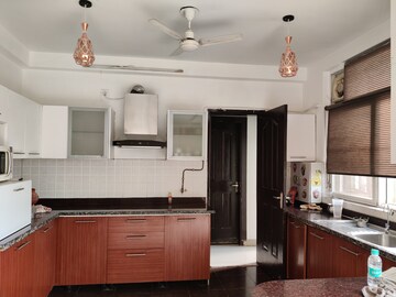 Kitchen in 4 BHK Apartment at ABA Orange County, Ahinsa Khand 1 – for Rent