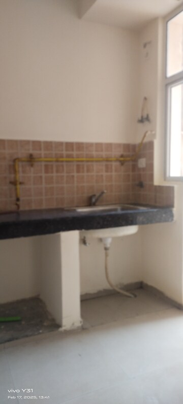 Kitchen in 2 BHK Apartment at Mahagun Mywoods, Sector 16c Greater Noida – for Rent