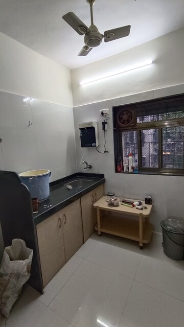 Living Room in 1 BHK Apartment at Malad CHS, Malad East – for Rent