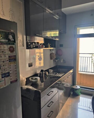 Kitchen in 2 BHK Apartment at Rustomjee Urbania Azziano, Majiwada – for Rent