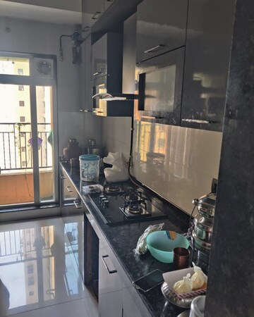 Kitchen in 2 BHK Apartment at Rustomjee Urbania Azziano, Majiwada – for Rent