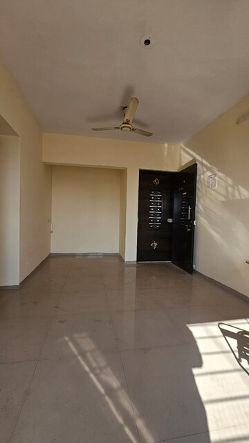 Living Room in 1 BHK Apartment at Unique Aurum, Mira Road – for Sale