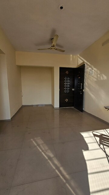 Living Room in 1 BHK Apartment at Unique Aurum, Mira Road – for Sale