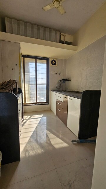 Kitchen in 1 BHK Apartment at Unique Aurum, Mira Road – for Sale