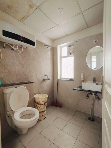 Bathroom in 3 BHK Apartment at International Airport Road – for Rent