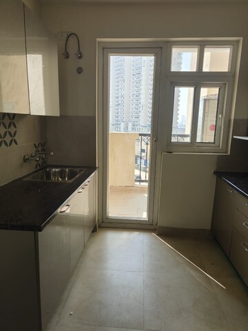 Kitchen in 3.5 BHK Apartment at ATS Triumph, Sector 104 – for Rent