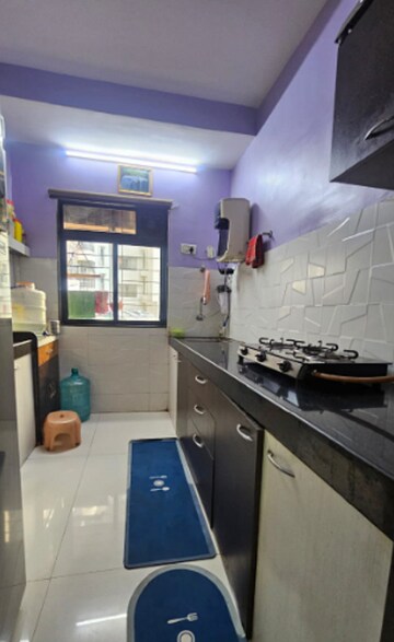Kitchen in 1.5 BHK Apartment at RNA NG Canary, Mira Road – for Rent