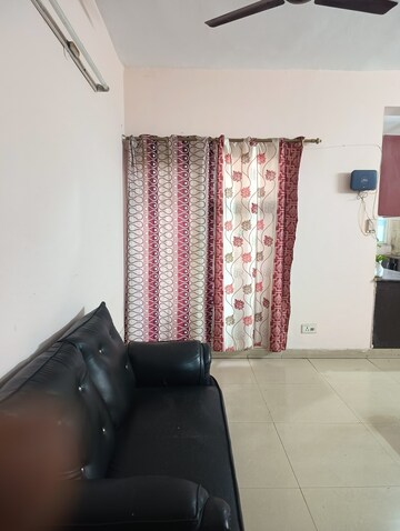 Living Room in 2 BHK Apartment at Aims Golf City, Sector 75 – for Rent