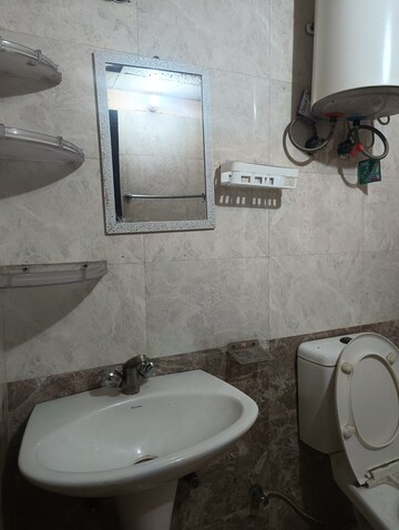 Bathroom in 2 BHK Apartment at Aims Golf City, Sector 75 – for Rent
