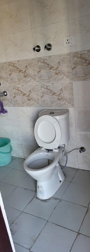 Bathroom in 2 BHK Apartment at Charms Castle, Raj Nagar Extension – for Sale