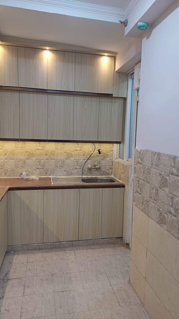 Kitchen in 2 BHK Apartment at Amrapali Golf Homes, Sector 4, Greater Noida – for Rent
