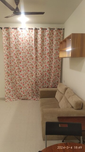 Living Room in 1 BHK Apartment at Hiranandani Queensgate, Bannerghatta – for Rent