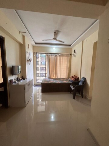 Living Room in 1 BHK Apartment at RNA NG Canary, Mira Road – for Sale