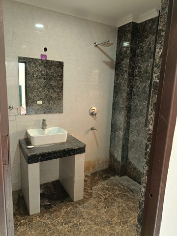Bathroom in 3 BHK Builder Floor at Freedom Fighters Enclave – for Rent