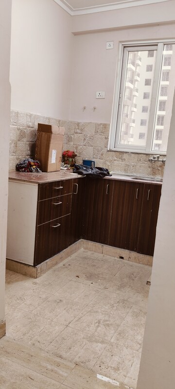 Kitchen in 2 BHK Apartment at Amrapali Golf Homes, Sector 4, Greater Noida – for Sale