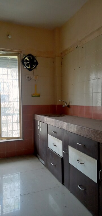 Kitchen in 2 BHK Apartment at Aakash Nidhi, Mira Road – for Rent