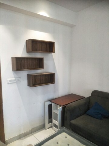Living Room in Studio Apartment at Supertech North Eye, Sector 74 – for Rent