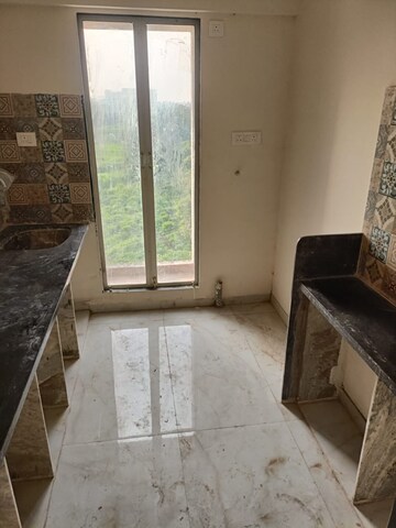 Kitchen in 1.5 BHK Apartment at Murbad Road – for Sale