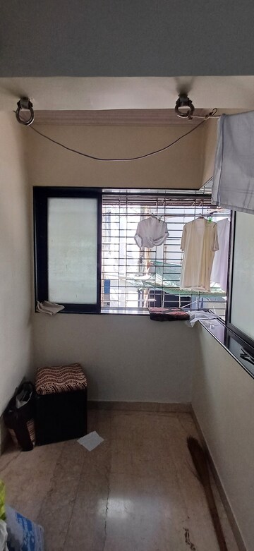 Living Room in 2 BHK Apartment at Malad SC CHS, Malad West – for Rent