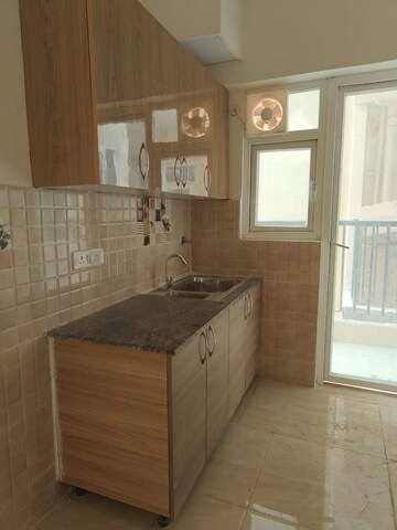 Kitchen in 2 BHK Apartment at Gaur City 7th Avenue, Sector 4, Greater Noida – for Rent