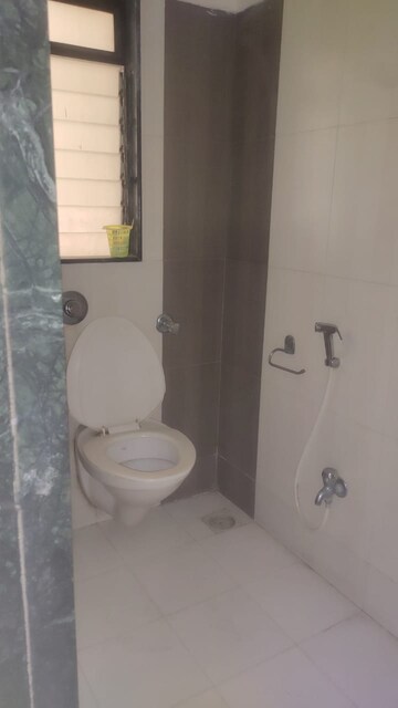 Bathroom in 2 BHK Apartment at Puranik City, Kasarvadavali – for Rent