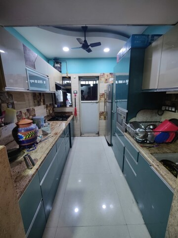 Kitchen in 2 BHK Apartment at Cosmos Jewels, Ghodbunder Road – for Rent