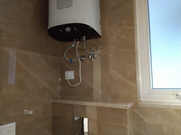 Bathroom in 4 BHK Apartment at Sarvodya Enclave – for Rent