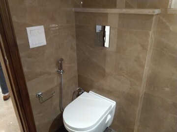 Bathroom in 4 BHK Apartment at Sarvodya Enclave – for Rent