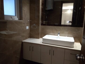 Bathroom in 4 BHK Apartment at Sarvodya Enclave – for Rent