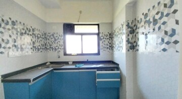 Kitchen in 1 BHK Apartment at Raunak Unnathi Woods Phase 7 A And B, Ghodbunder Road – for Sale