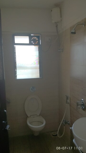 Bathroom in 1 BHK Apartment at Deepak Daffodils, Andheri East – for Rent