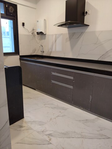 Kitchen in 2 BHK Apartment at Dev Leo Tower, Oshiwara – for Rent