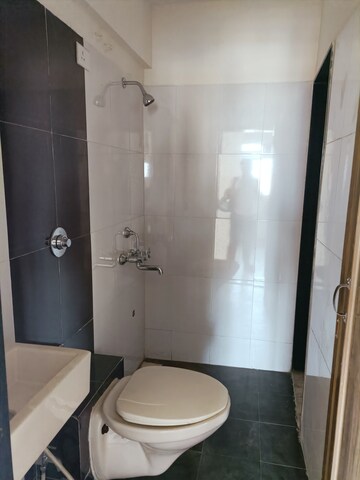 Bathroom in 1 BHK Apartment at Vihang Valley Phase 2, Kasarvadavali – for Sale