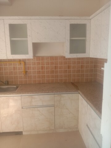 Kitchen in 2 BHK Apartment at Mahagun Mywoods, Sector 16c Greater Noida – for Rent