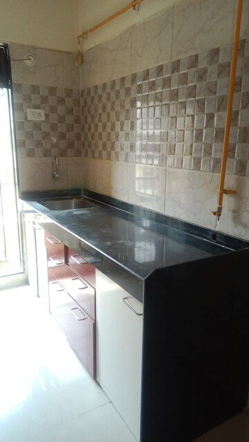 Kitchen in 2 BHK Apartment at Shree Swastik Heights, Virar West – for Rent
