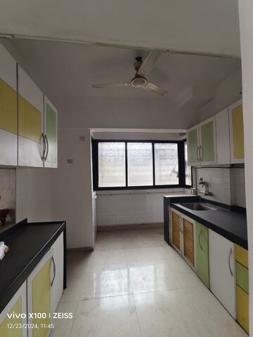 Kitchen in 3 BHK Apartment at Soham Garden, Manpada – for Rent