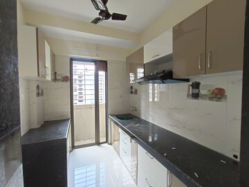 Kitchen in 1 BHK Apartment at Rustomjee Global City – for Sale