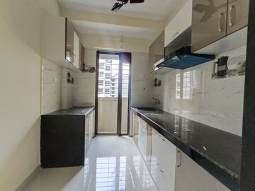 Kitchen in 1 BHK Apartment at Rustomjee Global City – for Sale