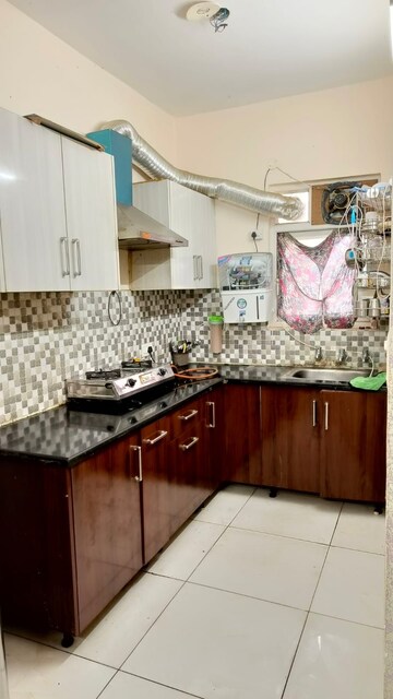 Kitchen in 2 BHK Builder Floor at Dhakoli Village – for Sale
