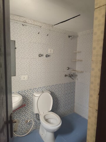 Bathroom in 3.5 BHK Apartment at Aims Golf City, Sector 75 – for Rent