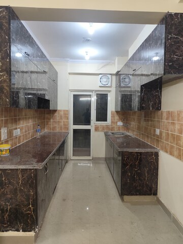 Kitchen in 2.5 BHK Apartment at Aims Golf City, Sector 75 – for Rent