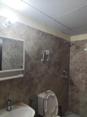 Bathroom in 2.5 BHK Apartment at Aims Golf City, Sector 75 – for Rent