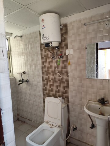 Bathroom in 3.5 BHK Apartment at Aims Golf City, Sector 75 – for Rent