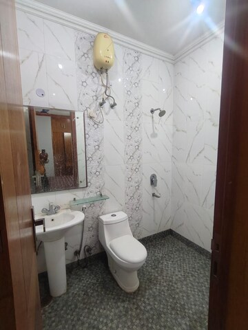 Bathroom in 3 BHK Apartment at Hargobind Enclave – for Rent