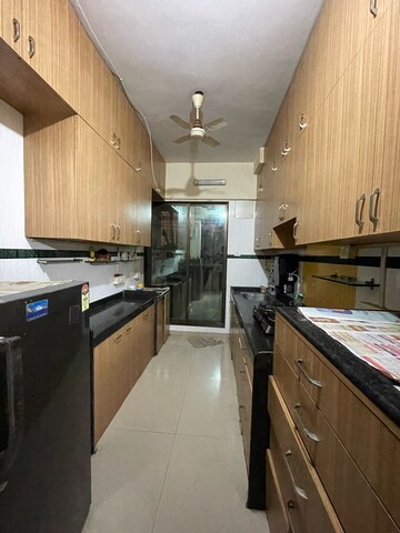 Kitchen in 3 BHK Apartment at Dedhia Palatial Height, Powai – for Rent