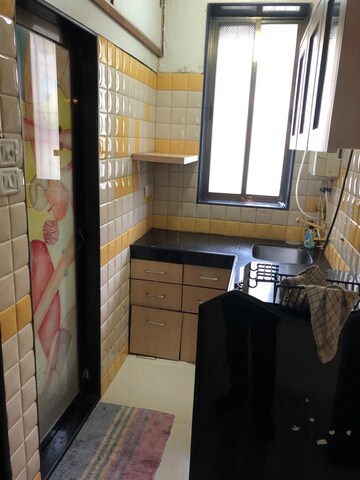 Kitchen in 2 BHK Apartment at Adarsh Nagar CHS Worli, Worli – for Rent